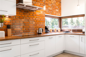 An exposed brick kitchen splashback