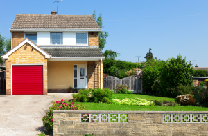 A garage with a red door attached to a house